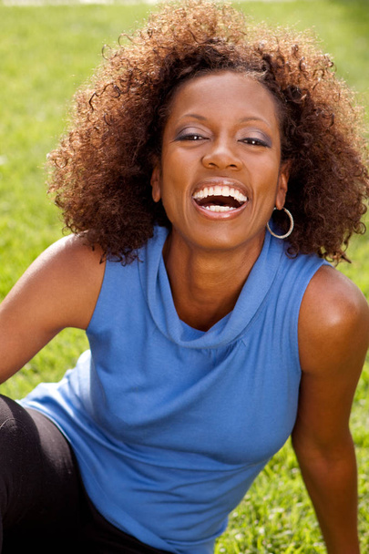 Beautiful mature African American woman smiling outside. - Fotoğraf, Görsel