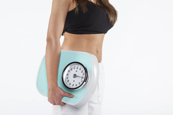 Woman holding weight - Fotó, kép