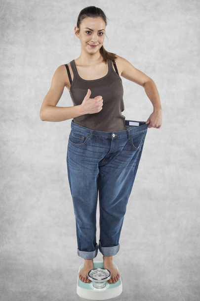Happy girl lost superfluous pounds - 写真・画像