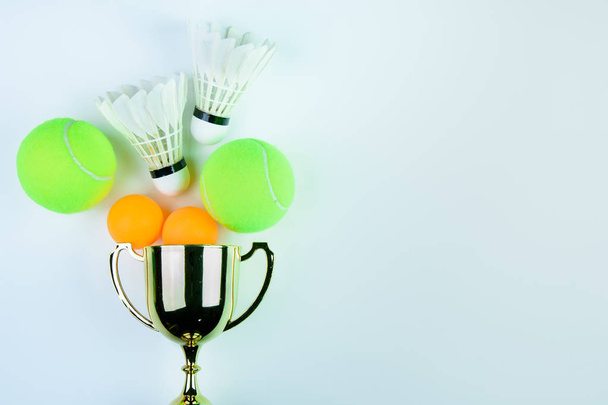 Golden trophy, Shuttlecock, Ping pong ball and Tennis ball isola - Photo, Image
