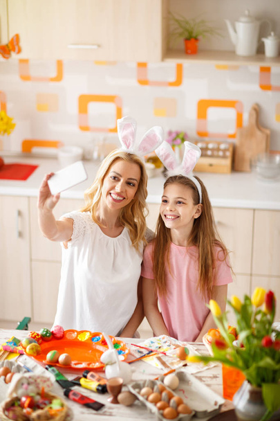 Selfie with daughter in kitchen for Easter - 写真・画像