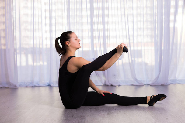 Woman stretching in the studio - Photo, image