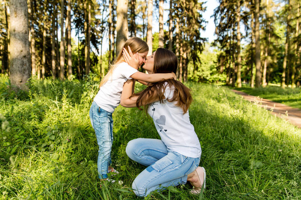 Mom and daughter in nature - Photo, Image