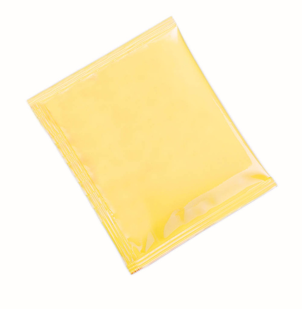 Bolsita de plástico amarillo en blanco para medicamentos, medicamentos, café, azúcar
,  - Foto, Imagen