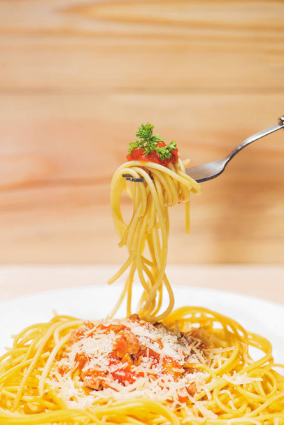 Close-up of asta spaghetti with tomato sauce, olives and garnish. Italian food.  - Zdjęcie, obraz