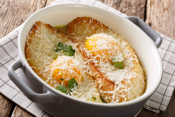 Delicious Pawese soup with toast, eggs and parmesan close-up. ho - Photo, Image