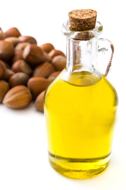 Hazelnuts oil isolated on white background - Фото, изображение