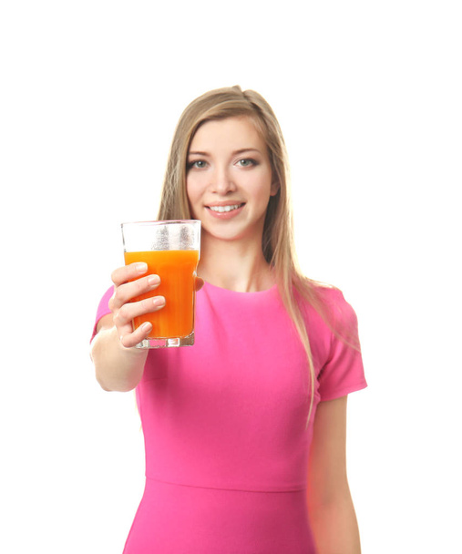 Beautiful young woman with glass of fresh juice on white background - Photo, image