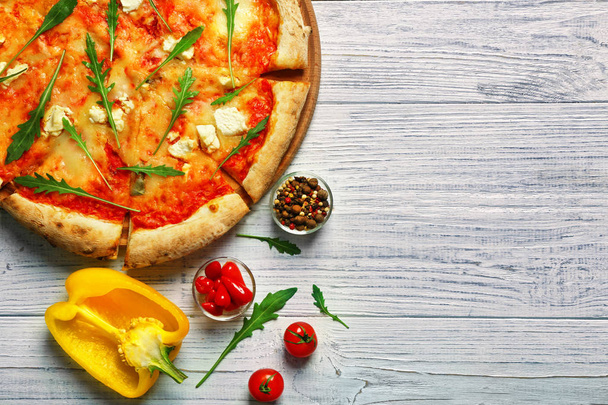 Delicious pizza with ingredients - Foto, afbeelding
