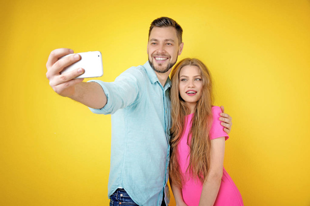 Happy young couple taking selfie  - Foto, afbeelding