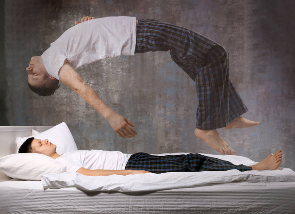 Young man suffering from sleep paralysis - Valokuva, kuva