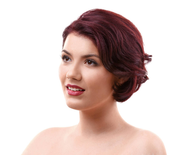 Portrait of young woman with beautiful haircut on white background - Photo, image