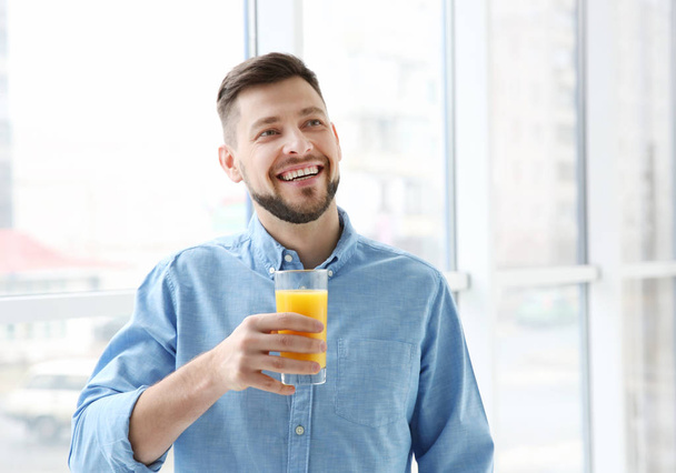 Handsome man with juice   - Foto, immagini