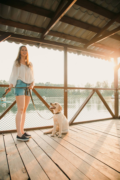 Beautiful girl and her dog - 写真・画像