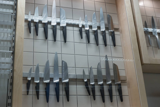 Set of knives hanging on the magnet. - Photo, Image