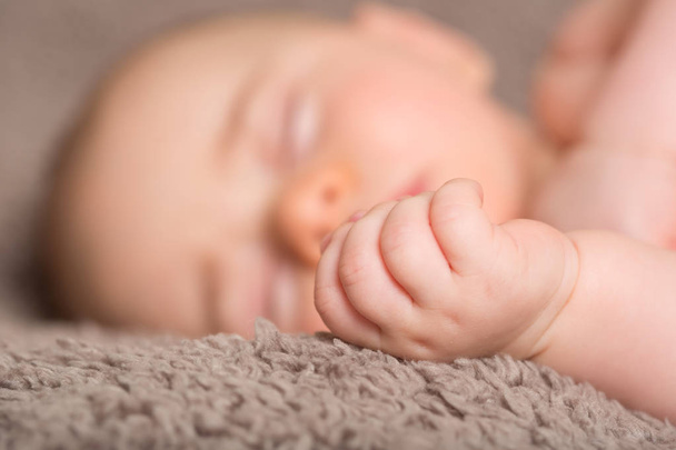 close-up portrait of a beautiful sleeping baby on blanchet - 写真・画像