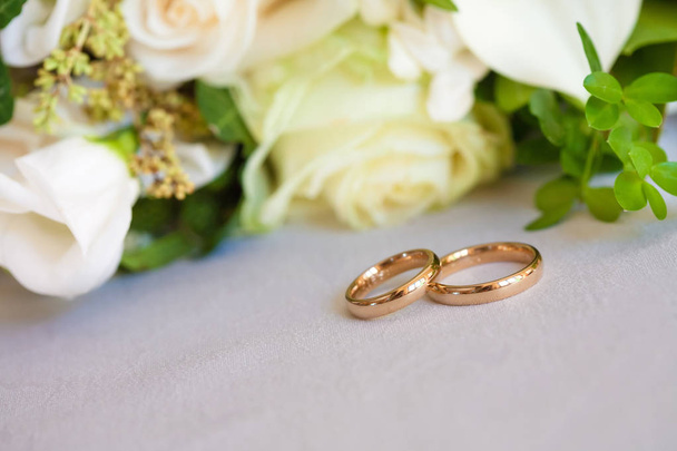 gold wedding rings on satin pillow - Photo, Image