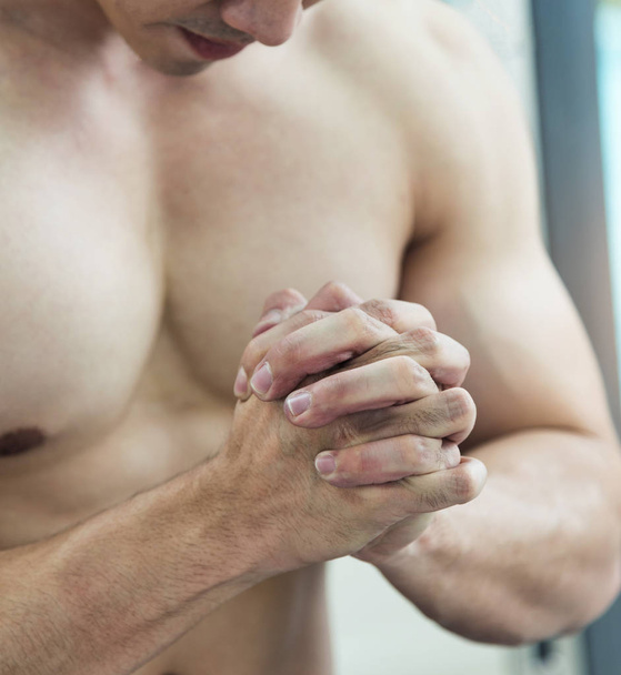 Stressed concept of Asian Muscular man. Close up of Male fists. - 写真・画像