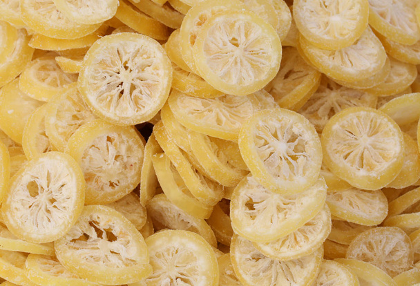 background of many slices of dried lemons - Photo, Image