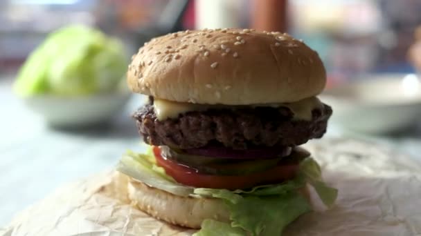 Closeup of a cheeseburger. - Footage, Video