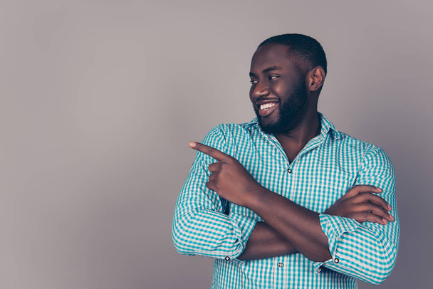 Portrait of happy afroamerican  bearded  man pointing something  - Zdjęcie, obraz