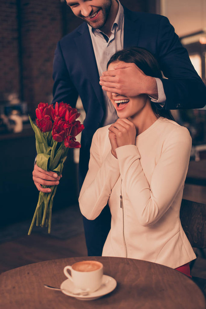 A man making surprise for his girlfriend in a cafe  - Fotó, kép