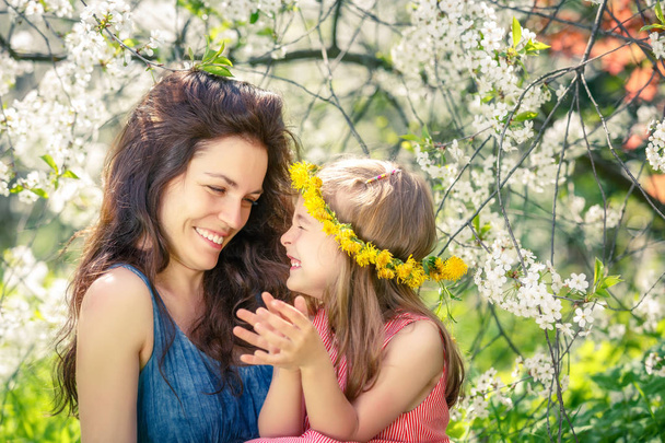 Mother and daughter in sunny park - Photo, image
