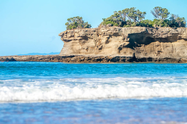 coastline with sand beach and rocks - Foto, afbeelding