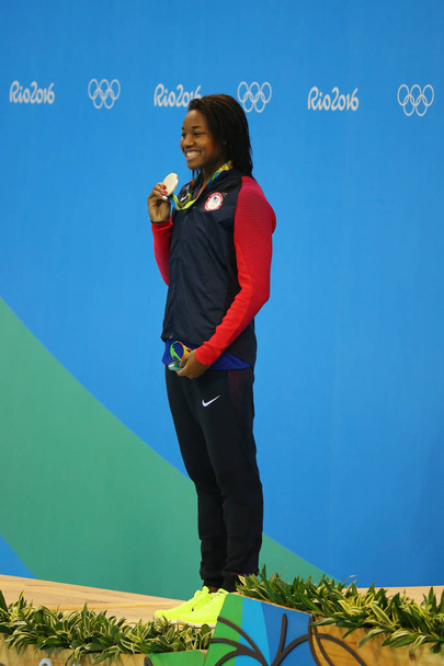 Silver medalist Simone Manuel of United States during medal ceremony after Women's 50 metre freestyle final of the Rio 2016 Olympic Games  - Valokuva, kuva