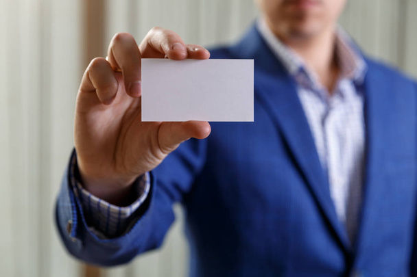 Businessman holding visit or business card. - Zdjęcie, obraz