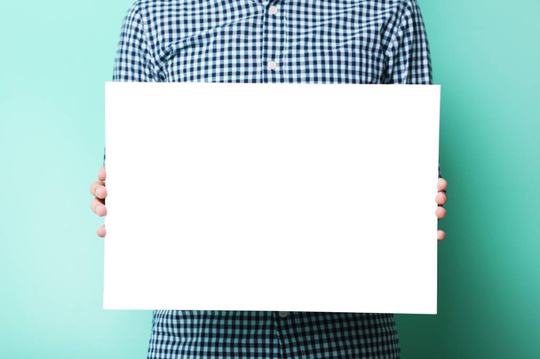 Man holding blank poster  - Zdjęcie, obraz