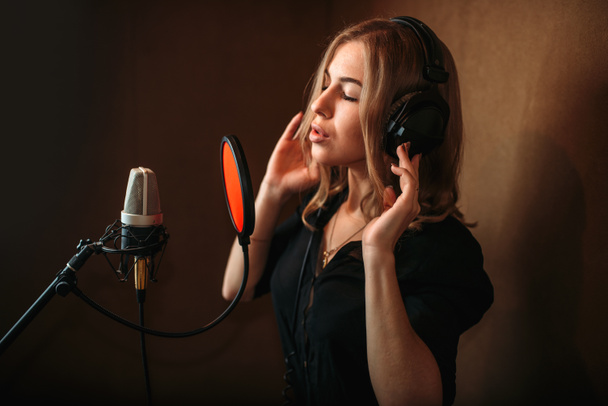female singer recording song  - Φωτογραφία, εικόνα