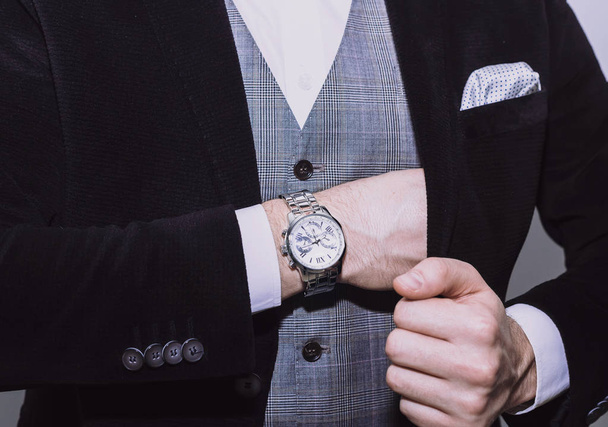 Cropped view of businessman with steel watch - Foto, afbeelding