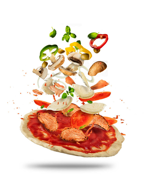 Flying ingredients with pizza dough, on white background - Foto, afbeelding