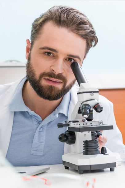 scientist working with microscope  - Photo, Image