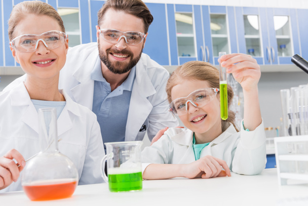 adult scientists and girl - Photo, Image