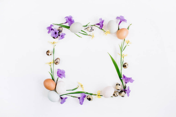 Easter eggs, quail eggs, yellow and purple flowers - Photo, Image