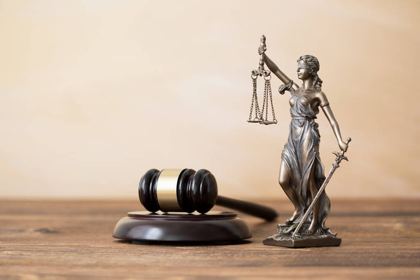 Themis statue and gavel on wooden table - Photo, Image