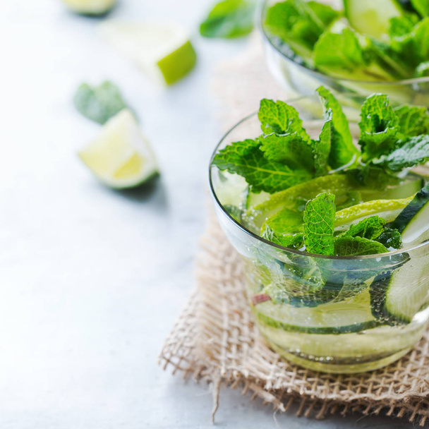 Cucumber lime mint fresh infused water detox drink cocktail lemonade - Фото, изображение