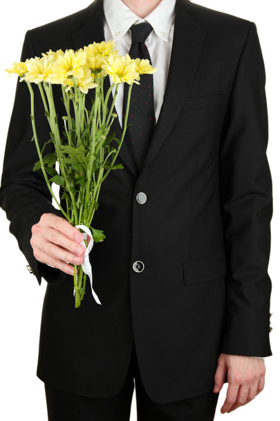 man holding flowers close-up - Fotó, kép