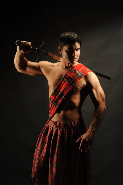 The hot soldier wears a highlander outfit - Photo, Image