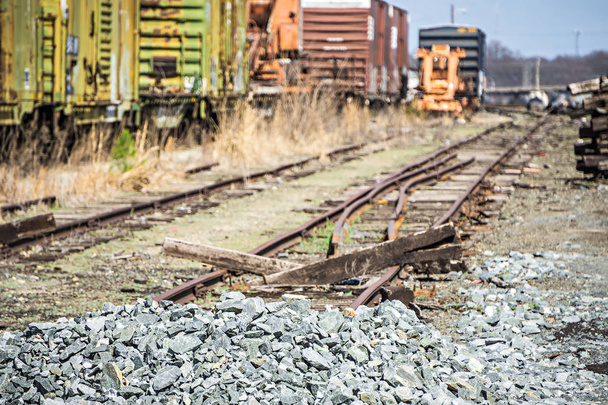 abandoned train tracks and wagons on railroad - Photo, Image