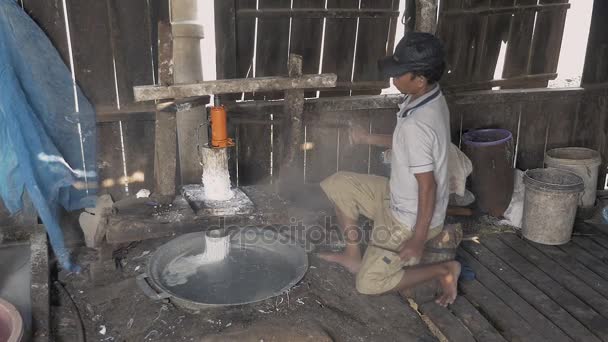 man using pressing machine to cut rice dough into strips - Footage, Video