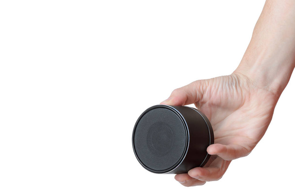 Portable mobile speaker keeps men right hand - Foto, imagen