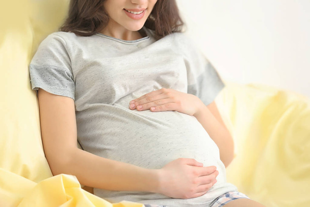 Beautiful pregnant woman resting at home, closeup - Фото, зображення