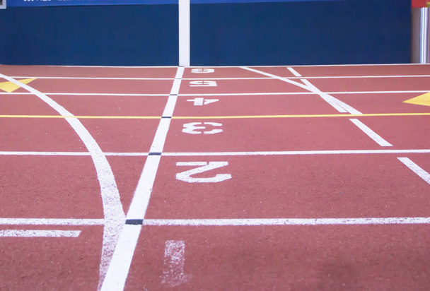 The start and finish line at an indoor track - Photo, Image