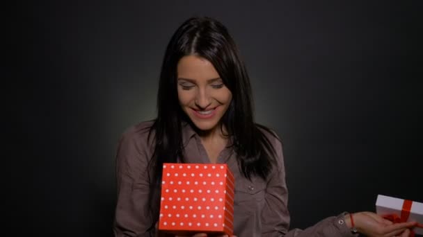 Beautiful woman disappointed when opening gift box - Кадры, видео