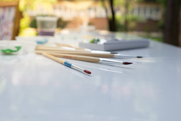 Used paint brush on white table. - Photo, Image