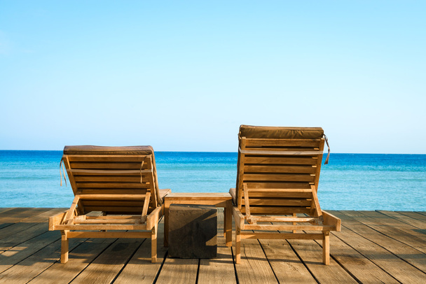 Two wooden beach chair, sea and clean sky - Фото, изображение