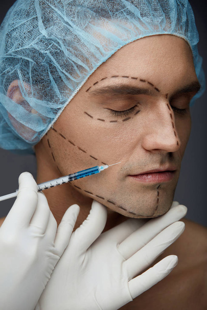 Male Face Beauty Injections. Handsome Man Getting Skin Injection - Foto, Bild